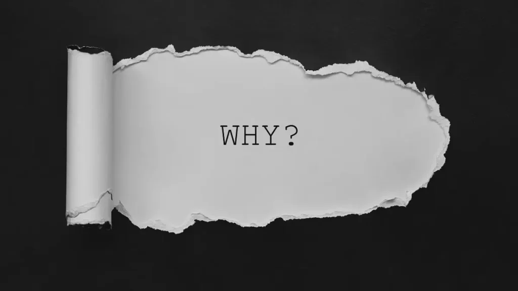 Paper with the word why, encouraging parents to reflect before choosing home education.
