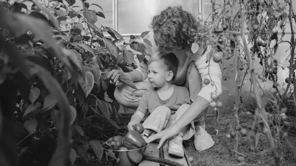 Parent and young child gardening together, representing a calmer, hands-on alternative to school through home education.