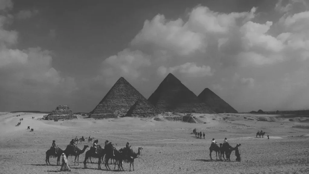 The pyramids of Giza in Egypt with people and camels in the foreground, representing a history topic for home education.